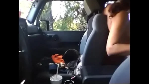 Unfaithful woman having sex with a colleague in the car